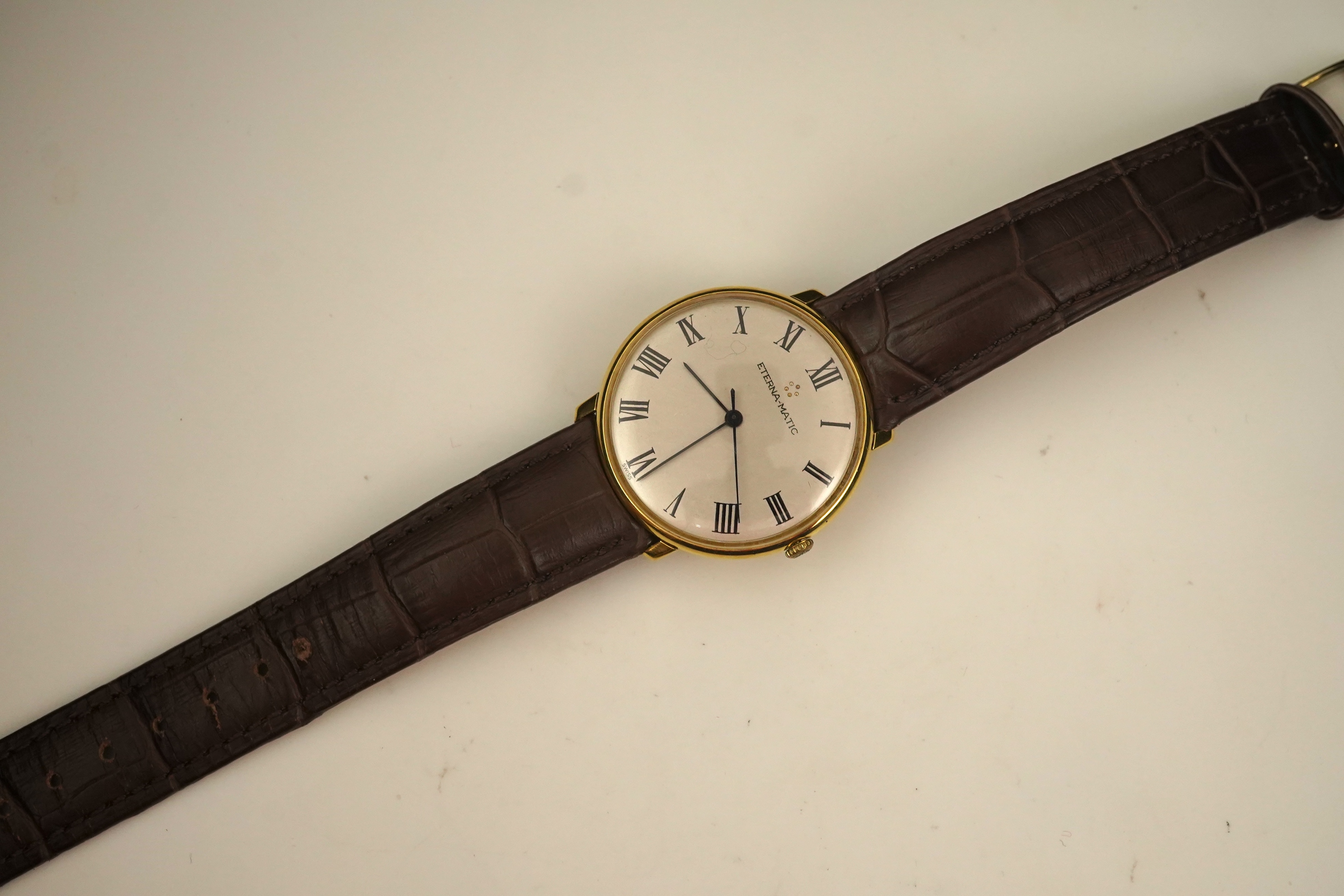 A gentleman's 18ct gold Eterna-Matic manual wind dress wrist watch, on a later associated Hirsch leather strap